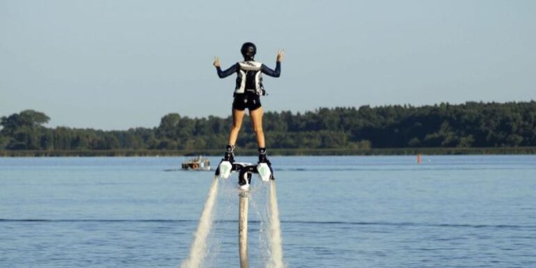 A man riding a jet pack.