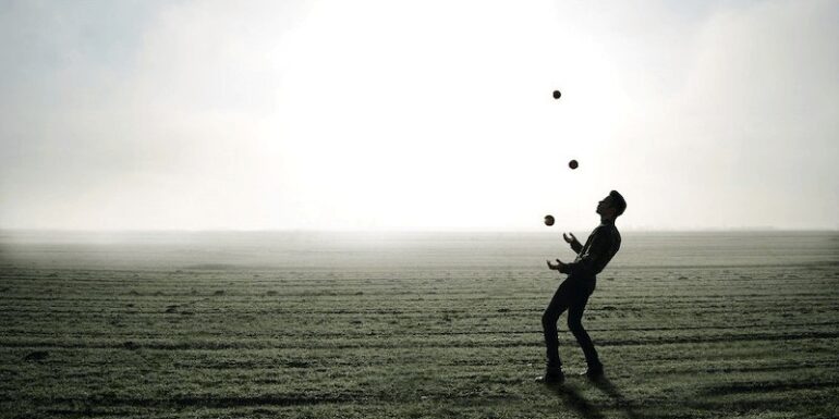 A figure juggling.