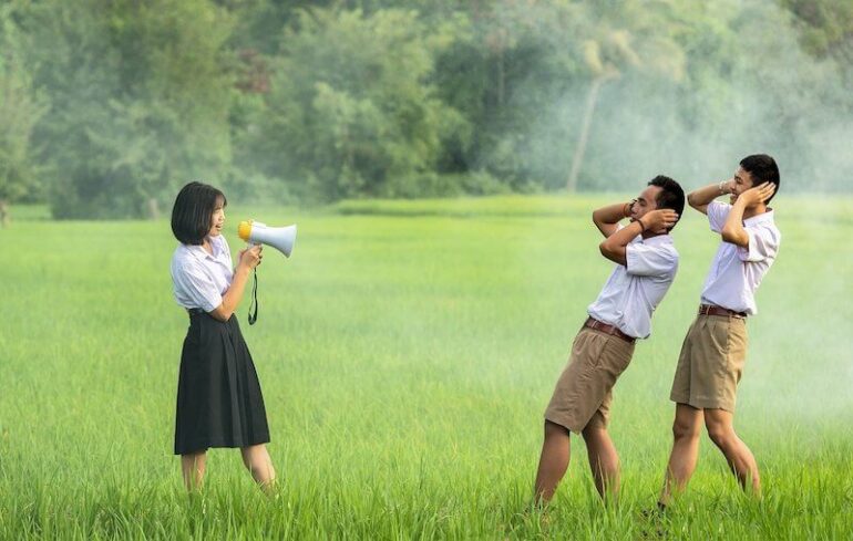 A person yelling into a megaphone.