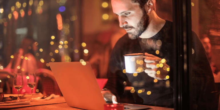 A man using a laptop.