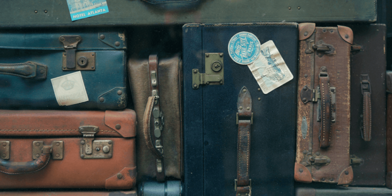 Multiple suitcases side by side.