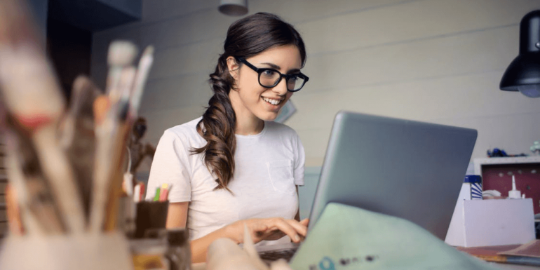 A woman on a laptop.